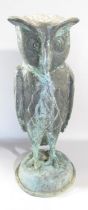 A copper wise old owl with eyebrows, in a weathered verdigris finish, raised on a domed dais, 43cm