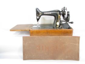 A Singer sewing machine, manually operated, No EK417262, in its original faux crocodile hard case