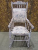 Edwardian rocking chair with carved cresting rail, later upholstered pad seat and back raised on