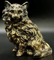 A silver gilt cat pepper pot by Michael Whitehill, London 2000, retailed by Grey-Harris & Co,