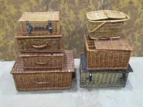 Seven contemporary wicker hampers of varying size and design
