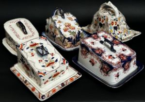 Collection of 15 Victorian and Edwardian cheese dishes and covers all boldly decorated in a floral