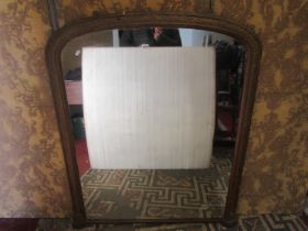 A Victorian overmantle mirror, the moulded arched frame with repeating floral and lattice detail and
