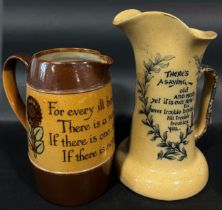 Two Doulton jugs with script, 'Nothing is Troublesome, That We Do Willingly' and 'For Every Ill