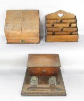 Three pieces of Edwardian desk top items, an oak stationery box, an inkwell with stationery box