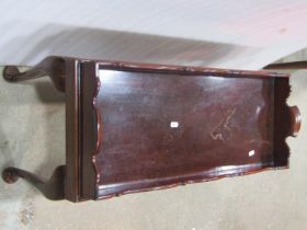 A Georgian tray raised on a later stand, the tray itself 74 cm x 29 cm, with stand 43 cm high