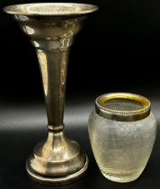 A silver posy vase, three spoons and a fork, together with a glass bon bon dish on a silver spread