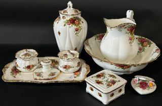 Royal Albert Country Roses ceramics to include basin & ewer, lidded urn, dressing table set etc.