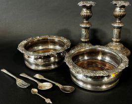 Two silver plated wine coasters and a pair of candlesticks and three spoons and fork (8)