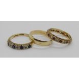 Three vintage 9ct rings; a wedding ring with engraved detail and two gem set dress rings, 7.6g total