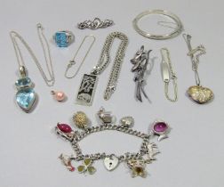 Collection of contemporary silver jewellery to include a novelty charm bracelet, a hinged bangle,