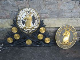 Two painted cast alloy Whitbread & Co oval plaques one on a foliate bracket (2)