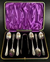 A green leather cased set of six silver teaspoons and a sugar tong, Sheffield 1900 maker Richard