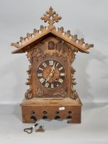 A 19th century Tyrolean bracket cuckoo clock, the casework in the form of a chalet with cuckoo and