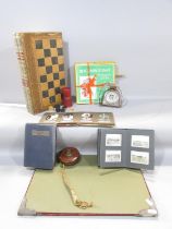 Leather backgammon / draughts set together with "stirrup" weather guage, retractable tape measure,