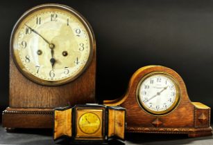 Oak mantle clock with two train striking movement, further example with carved and shaped oak case