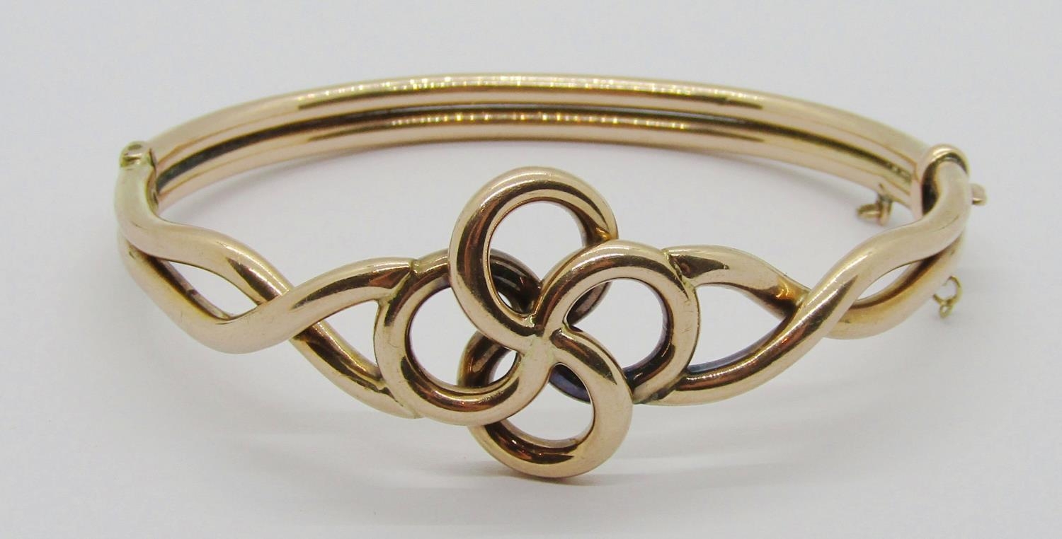 Edwardian Celtic style 9ct hinged bangle, 11.6g