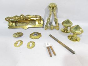 Victorian brass door furniture, consisting of a letter box, door knocker, a pair of door knobs,
