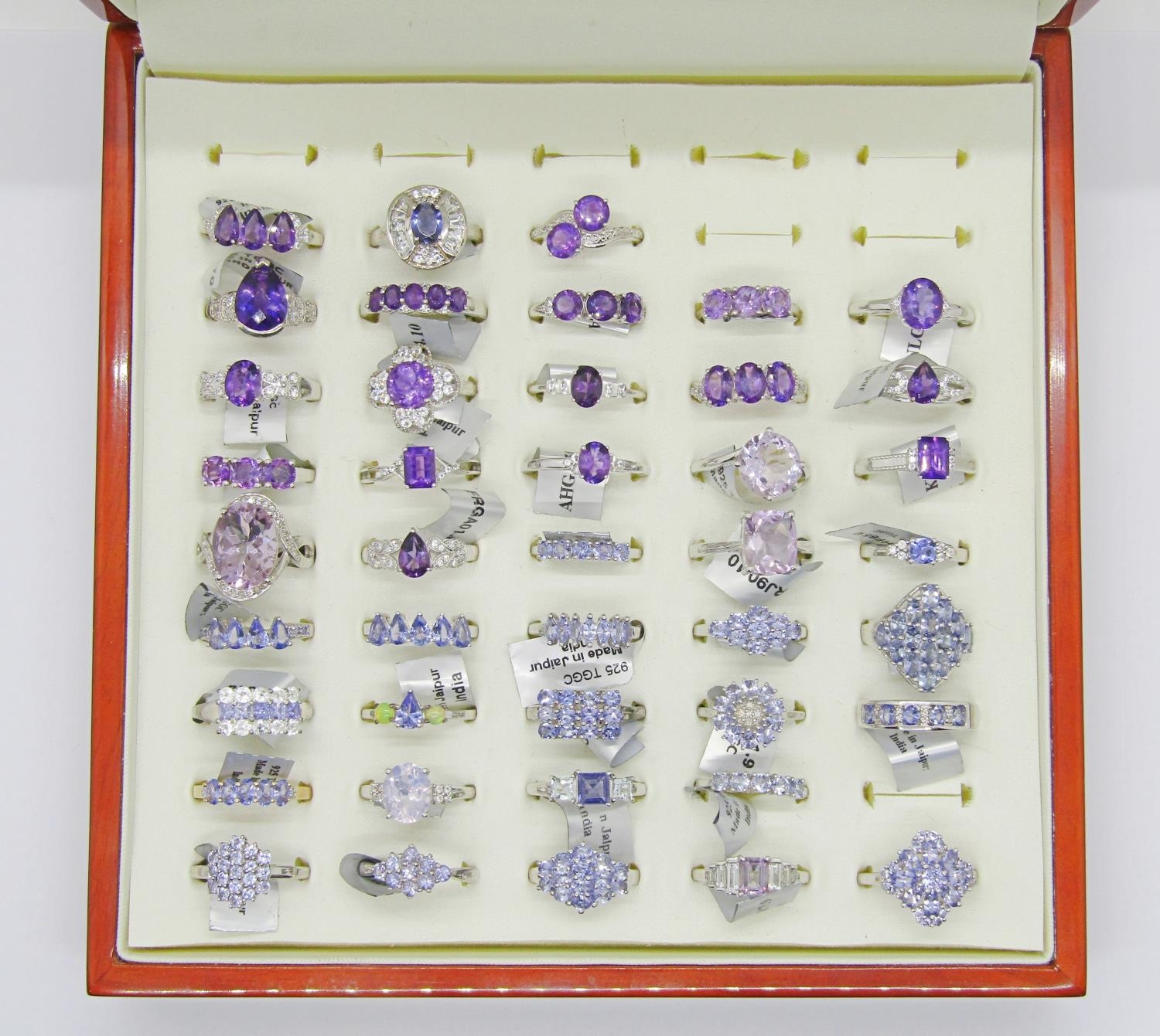 Collection of purple - violet gem set silver dress rings, to include amethyst, tanzanite, opal,