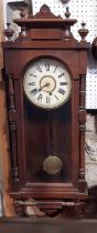 Late 19th century Ansonia wall clock with column supports and eight day time piece