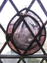 An enamel washing basin and two enamel jugs, a gold carved angel, a watering can and a stained glass