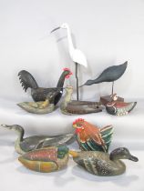 A collection of hand painted wooden decoy ducks, chickens, waders etc