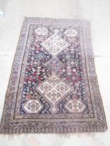 A Khameseh type carpet with three interlocking medallions 184cm x 150cm