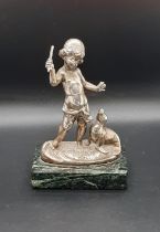 Silver plated model of a child with a seal, marble box