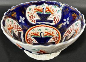 19th century ironstone Junket bowl with hand painted floral detail within blue reserves with the