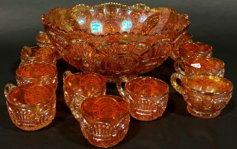 A Carnival Tangerine Glass punch bowl and eleven cups together with a jug, bowl and vase.