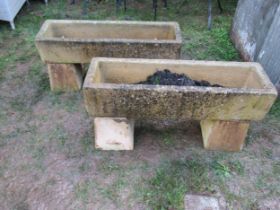 A pair of weathered composition stone planters of rectangular form, 19cm high, 86 x 26, raised on