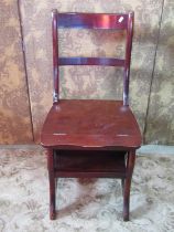 A contemporary reproduction stained hardwood bar back Metamorphic library chair/steps