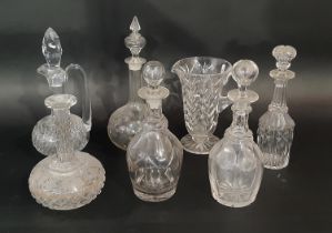 A collection of late 19th and early 20th century cut glass decanters, of varying shapes and sizes,