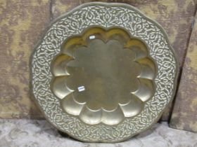 Indian brass dish with embossed detail to the borders, 80cm diameter