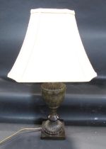 A contemporary vase shaped table lamp in a green marble effect finish, with a pagoda shaped shade,