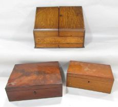 An Edwardian oak desk top stationery box with a fitted interior, together with two mahogany boxes.