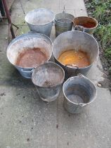 Two vintage Galvanised oval tin baths together with a stack of further galvanised buckets of varying