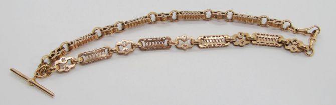 9ct fancy link Albert chain with pierced decoration, clasp and T-bar stamped maker 'SJ Ltd',