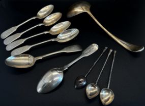 A mixed selection of silver items including a sugar sifter, an egg cup & spoon, an engine turned 8