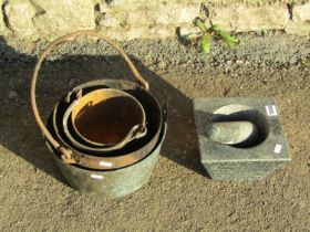 A small contemporary granite square tapered pestle and mortar together with an old iron cooking