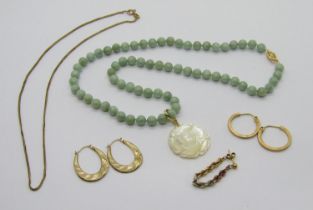 Modern 14k jade bead necklace, hung with a 14k carved mother of pearl flower pendant, together