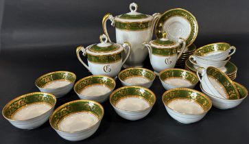 A Limoges porcelain tea service, cups, sugar basin, teapot, etc together with a leaf shaped
