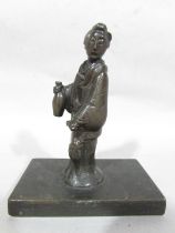 A Japanese Bronze figure of a Courtier holding a parasol and a bottle, raised on a rectangular