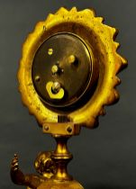 19th century gilt mantle clock the painted dial within a flower head border, surmounted on an onyx