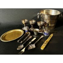A mixed collection of silver plated items including an ice bucket/ wine cooler, a tureen with