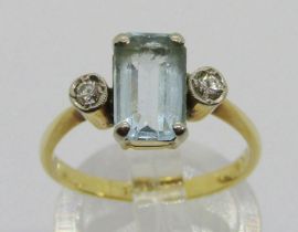 Early 20th century 18ct emerald-cut aquamarine and diamond three stone ring, size J, 3.4g