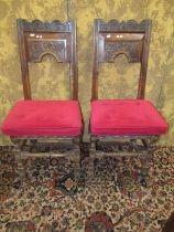 A pair of late 17th century oak chairs, the open shallow carved backs initialled ‘CW; and dated