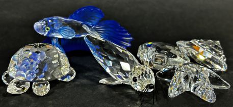 A Swarovski crystal collection to include sea themed pieces comprising a turtle, shells, starfish,