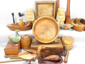 A large collection of wooden items, including clogs, ducks, boxes, fruit bowl, jar, tribal figure
