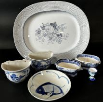 Blue and white ceramic 'Royal Granite' meat platter, two Chinese wall planters, two willow pattern